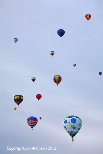 Multitude of Hot Air Balloons hang in the air